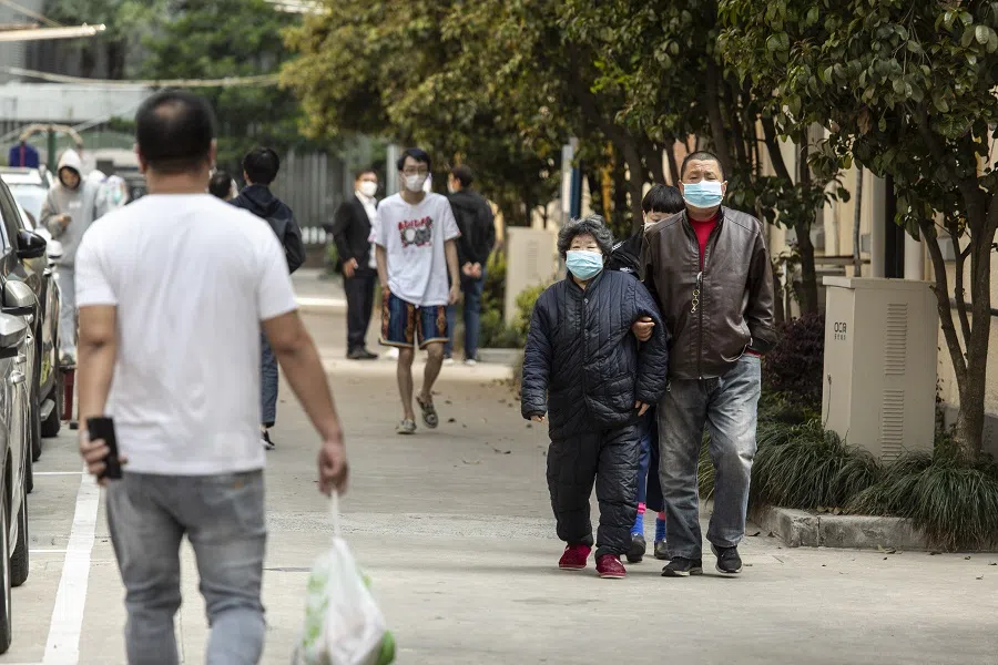 Residents take part in a round of Covid-19 testing during a lockdown in Shanghai, China, on 7 April 2022. (Qilai Shen/Bloomberg)