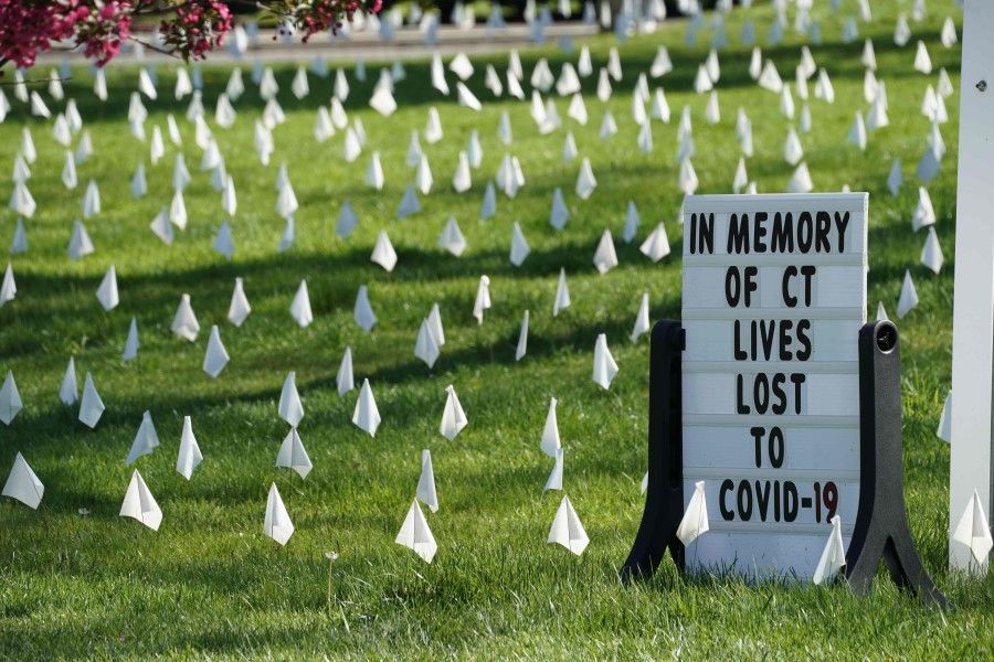 Thousands of white markers are seen on the lawn at the First Congregational Church of Greenwich, Connecticut, 4 May 2020, in memory of the many lives lost as a result of the coronavirus. (Timothy A. Clary/AFP)