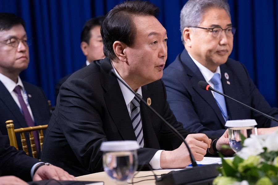 South Korean President Yoon Suk-yeol (centre) speaks during a trilateral meeting with US President Joe Biden and Japanese Prime Minister Fumio Kishida on the sidelines of the East Asia Summit during the 40th and 41st Association of Southeast Asian Nations (ASEAN) Summits in Phnom Penh, Cambodia, on 13 November 2022. (Saul Loeb/AFP)