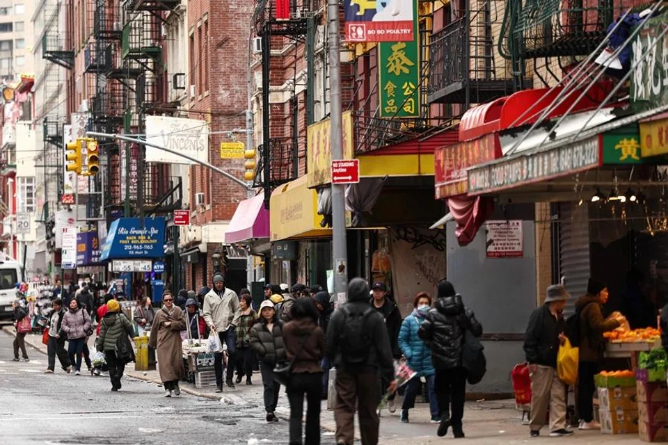 People move along a street of Chinatown in the Manhattan borough of New York City on 6 March 2026. (Charly Triballeau/AFP)