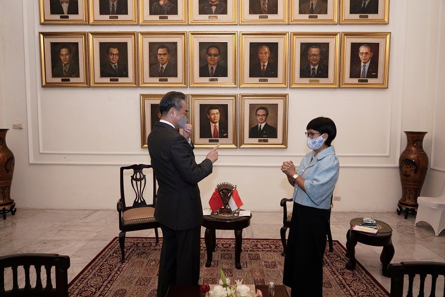Chinese Foreign Minister Wang Yi talks with Indonesia's Foreign Minister Retno Marsudi during their meeting in Jakarta, Indonesia, 13 January 2021. (Indonesia's Ministry of Foreign Affairs/Handout via Reuters)