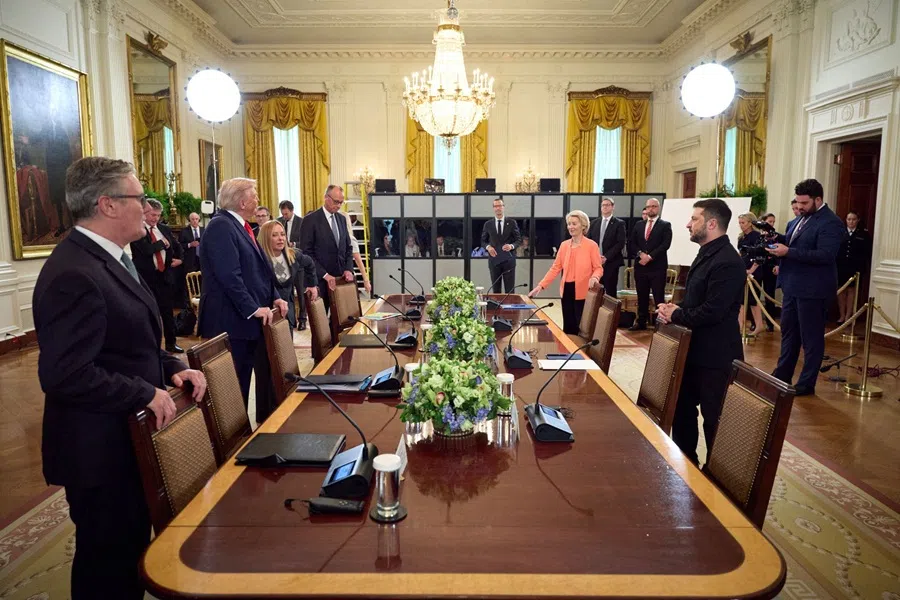 Ukrainian President Volodymyr Zelenskyy gathers with British Prime Minister Keir Starmer, US President Donald Trump, Italian Prime Minister Giorgia Meloni, German Chancellor Friedrich Merz, and European Commission President Ursula von der Leyen in the East Room of the White House in Washington, DC, on 18 August 2025. (AFP)