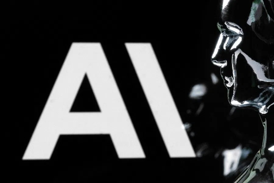 This photograph shows a figurine in front of the logo of the US artificial intelligence safety and research company Anthropic during a photo session in Paris on 13 February 2026.