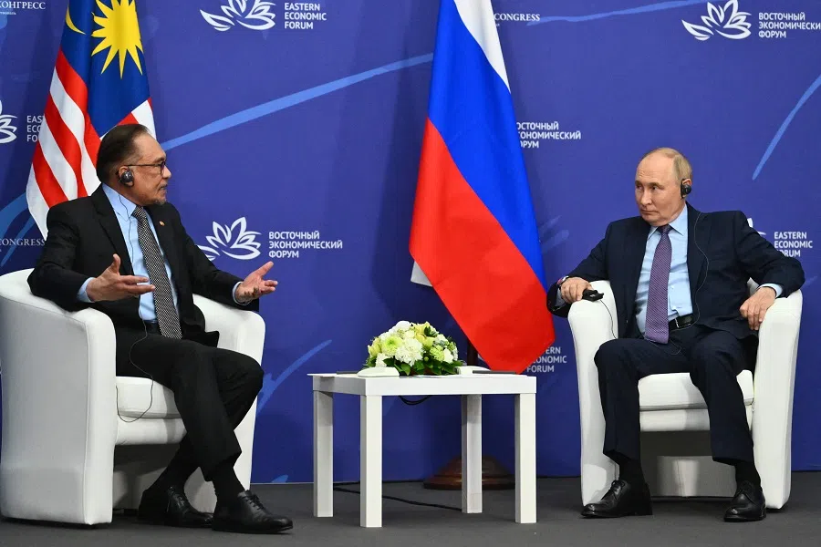 In this pool photograph distributed by the Russian state agency Sputnik, Russia’s President Vladimir Putin meets with Malaysia’s Prime Minister Anwar Ibrahim on the sidelines of the Eastern Economic Forum in Vladivostok on 4 September 2024. (Kristina Kormilitsyna/AFP)