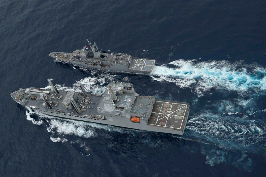 This handout photo taken and released by the Indian Navy on 18 November 2020 shows a ship refuelling during the second phase of the Malabar naval exercise in the Arabian sea. (Indian Navy/AFP)