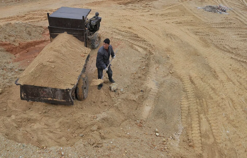 A labourer works at a site of a rare earth metals mine at Nancheng county, Jiangxi province, on 14 March 2012.  (Reuters)