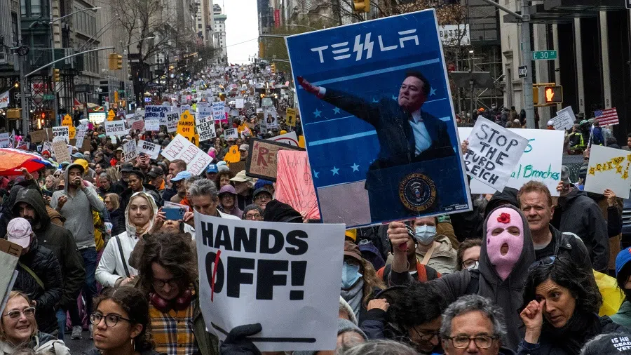 People take part in the nationwide “Hands Off” anti-Trump protests in New York City, US, on 5 April 2025. (Eduardo Munoz/Reuters)