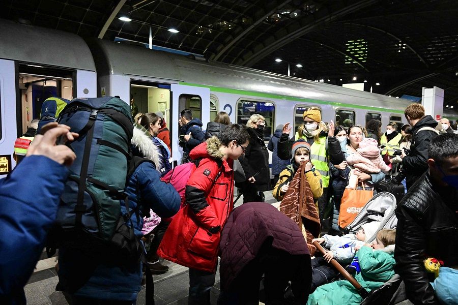 People arrive on a train from Ukraine's border at Berlin's main train station in Germany on 2 March 2022. (Tobias Schwarz/AFP)