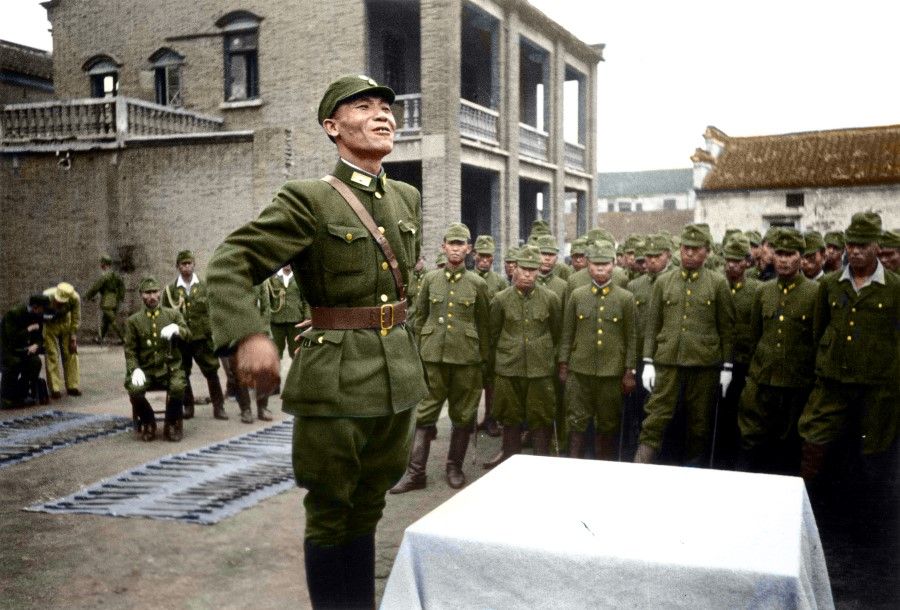 September 1945: Chinese officers inspecting the Japanese POW camp in Wuhu and explaining the policies of the Chinese government to the rows of Japanese POWs.