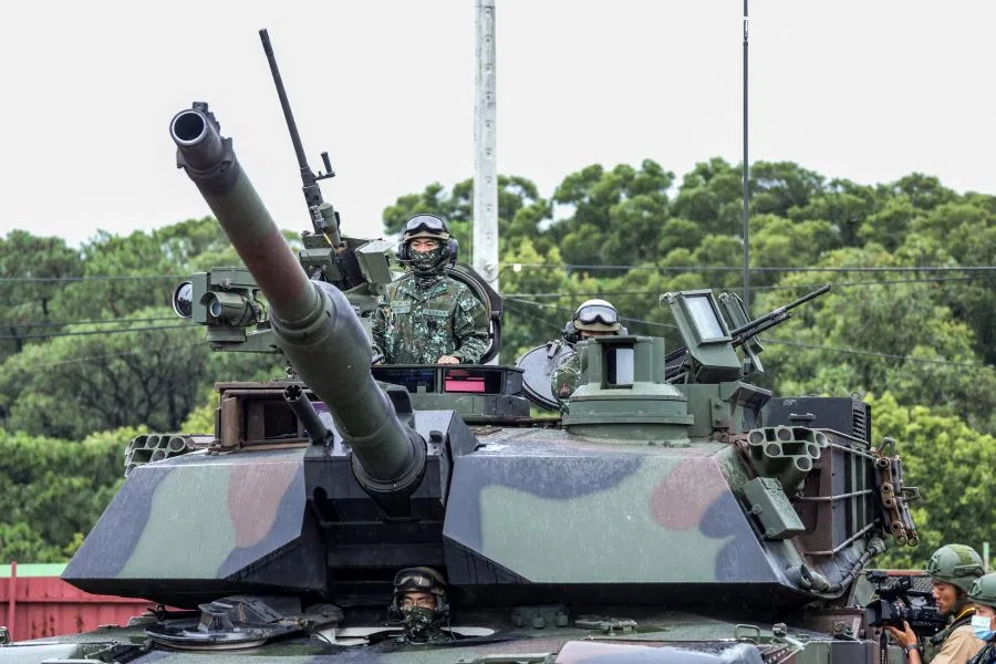Taiwanese soldiers operate a US-made M1A2T Abrams tank during a live-fire shooting session for Taiwan’s first batch of the advanced tank, which takes place separately from the annual Han Kuang military exercise, in Hsinchu on 10 July 2025. (I-Hwa Cheng/AFP)