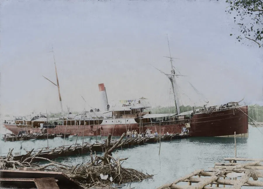 A coolie ship arriving at the Kallang River in Singapore. This is a rare photo of a coolie ship, which also shows what the Kallang River used to look like. The ship is not a large one, and might have been transporting cargo as well as coolies. Some of the cargo might have been transported directly to the Kallang River, bypassing the quays, possibly because there were also cargo points at the Kallang River. However, there were no large wharf facilities at the Kallang River, and the ship had to be anchored in the river itself, with people and goods moved via floating bridges formed by a chain of smaller boats.