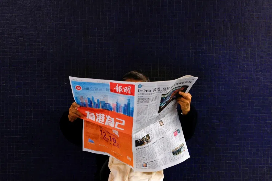 An advertisement calling to vote for the Legislative Council election is seen on the front page of a local newspaper in Hong Kong, China, 19 December 2021. (Tyrone Siu/Reuters)
