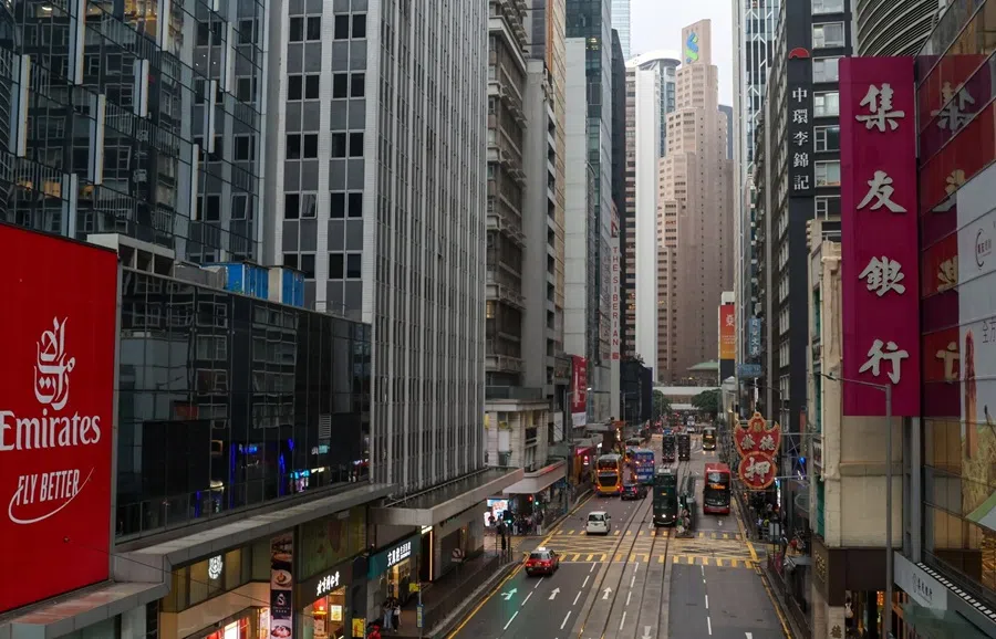 Vehicles travel along Des Voeux Road in Central district in Hong Kong, China, on 5 August 2025. (Yik Yeung-man/Bloomberg)