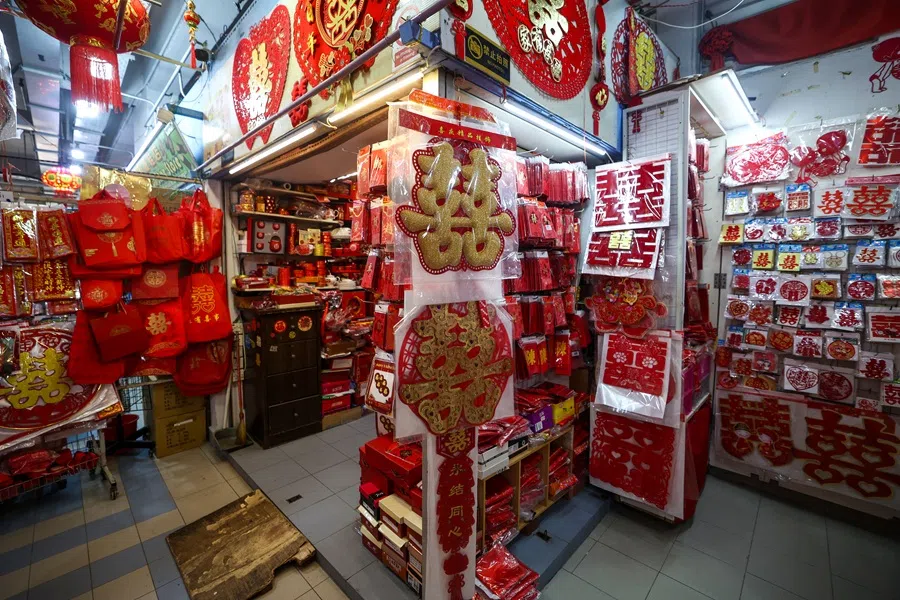 It is as if time has stood still at a traditional wedding scene at K.K Marriage Goods in Chinatown.