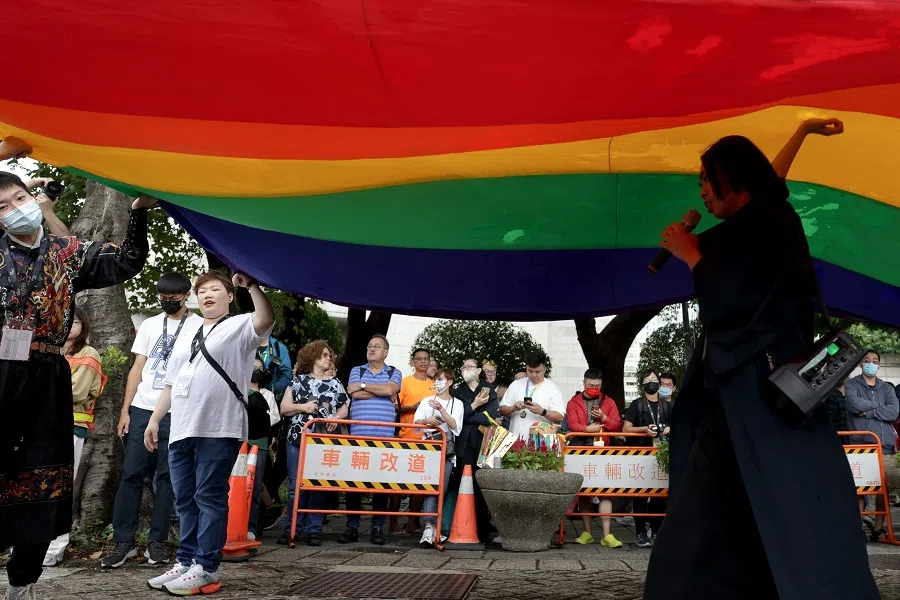 People hoist a huge rainbow flag during Taiwan's annual LGBTQ pride parade in Taipei, Taiwan, on 28 October 2023. (I-Hwa Cheng/AFP)