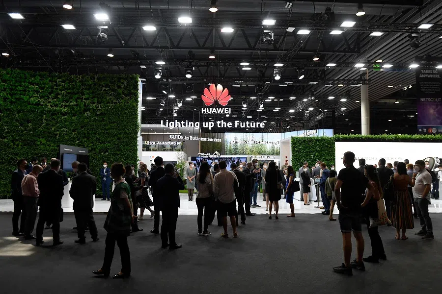 People visit the Huawei stand at the Mobile World Congress (MWC) fair in Barcelona, Spain on 29 June 2021. (Josep Lago/AFP)