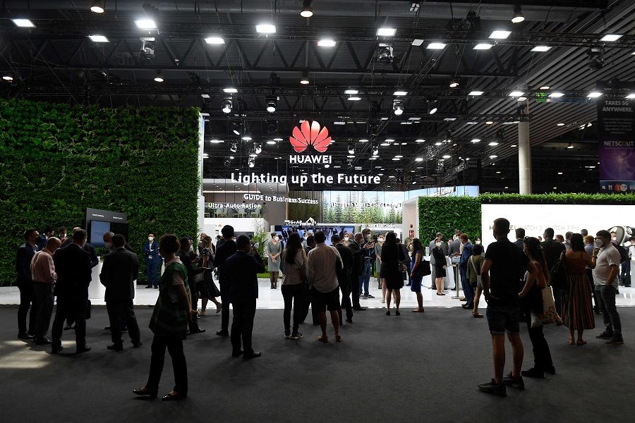People visit the Huawei stand at the Mobile World Congress (MWC) fair in Barcelona, Spain on 29 June 2021. (Josep Lago/AFP)