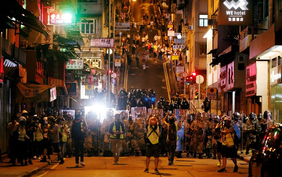 Police officers line up during a protest against what the activists see as excessive police force against protesters during previous demonstrations, near China's Liaison Office, Hong Kong, China, 28 July 2019. (Edgar Su/File Photo/Reuters)