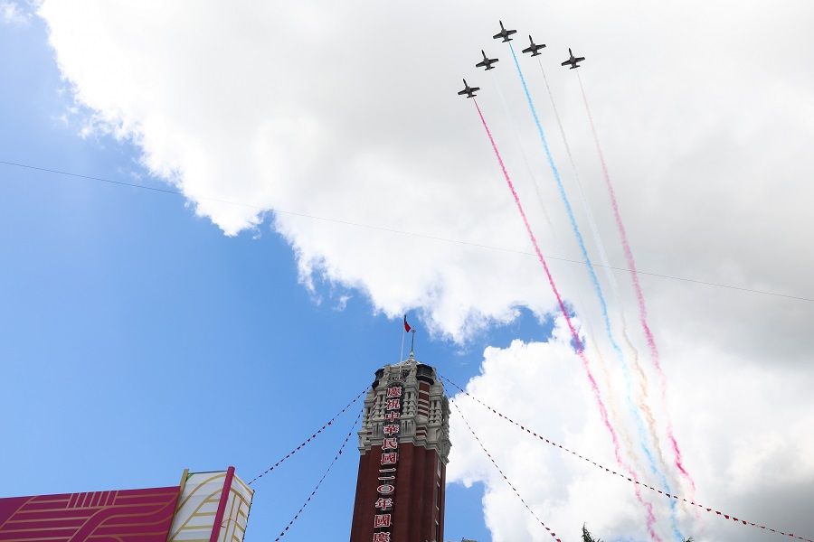 A formation of airplanes fly during the Double Tenth Day celebration in Taipei, Taiwan, 10 October 2021. (Ann Wang/Reuters)