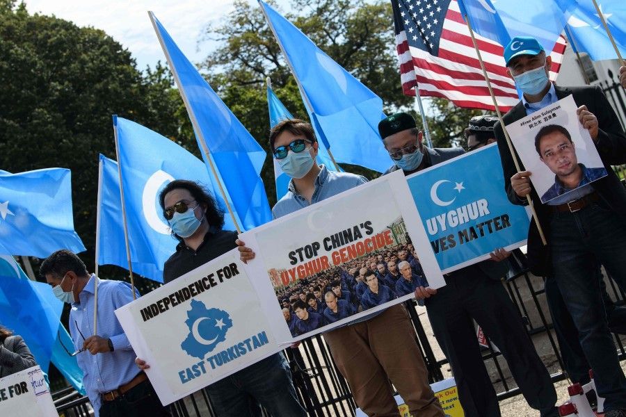 Uyghurs of the East Turkistan National Awakening Movement (ETNAM) hold a rally to protest the 71st anniversary of the People's Republic of China in front of the White House in Washington, DC, on 1 October 2020. (Nicholas Kamm/AFP)