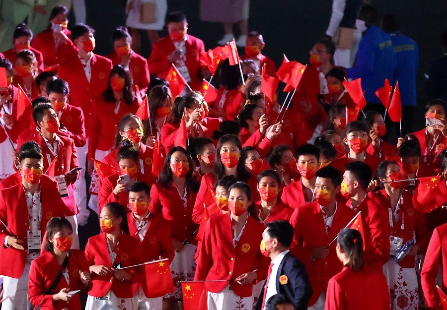 Athletes from China are seen during the opening ceremony of the Tokyo 2020 Olympics, 23 July 2021. (Lucy Nicholson/Reuters)
