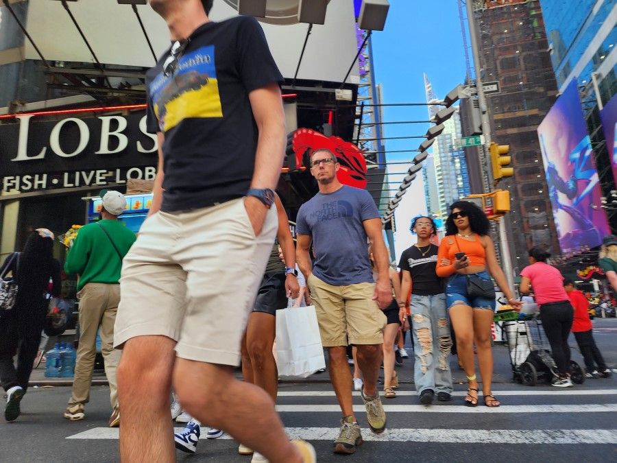 Pedestrians walk in New York City, US, on 23 August 2023. (SPH Media)