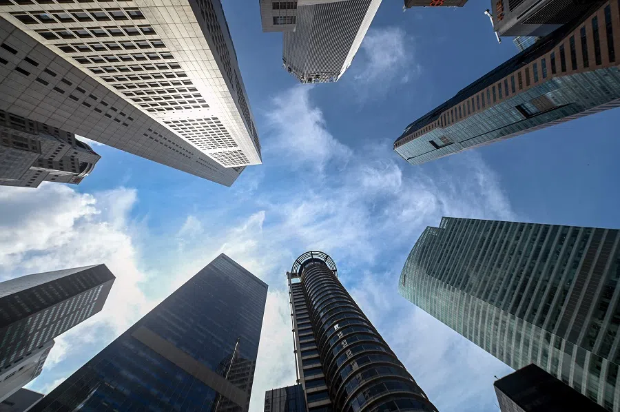 A general view shows high-rise office buildings in the Raffles Place financial business district in Singapore on 13 August 2024.  (Roslan Rahman/AFP)