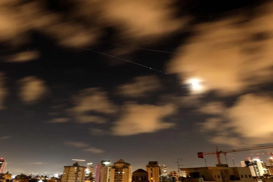 Rocket trails are seen in the sky above the Netanya, Israel, on 8 April 2026. 