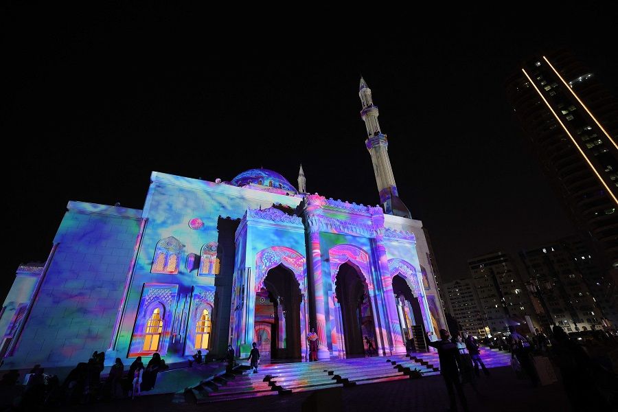 The Al-Noor Mosque is lit up with projection mapping in a colourful display for the 13th annual Sharjah Light Festival in the emirate of Sharjah on 17 February 2024.  (Giuseppe Cacae/AFP)