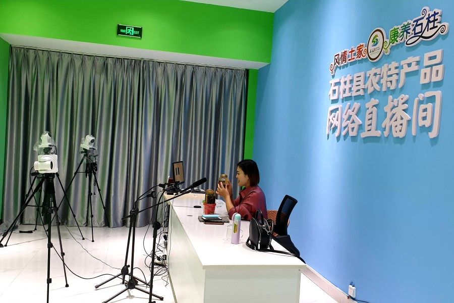 An in-house studio in Shizhu's e-commerce park connects buyers to products.