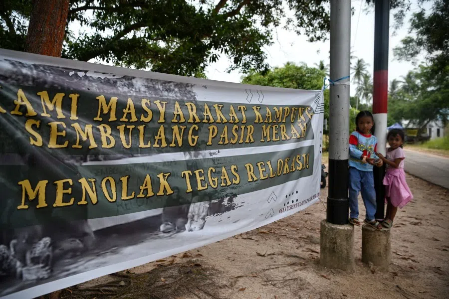 A banner declaring the villagers’ refusal to relocate at Pasir Merah, a fishing village in Sembulang, Rempang, a small island adjacent to Batam Island. In late August 2023, the Indonesian government decided that some 7,500 Rempang islanders had to leave their homes immediately for a new economic zone on the island that has been earmarked to pull in some US$26.6 billion in investment by 2080. Residents are against the Chinese-funded eco project, Rempang Eco-City, a joint venture between BP Batam and a local company, PT Makmur Elok Graha (MEG), which has partnered with China’s Xinyi International Investment Ltd. (SPH Media)