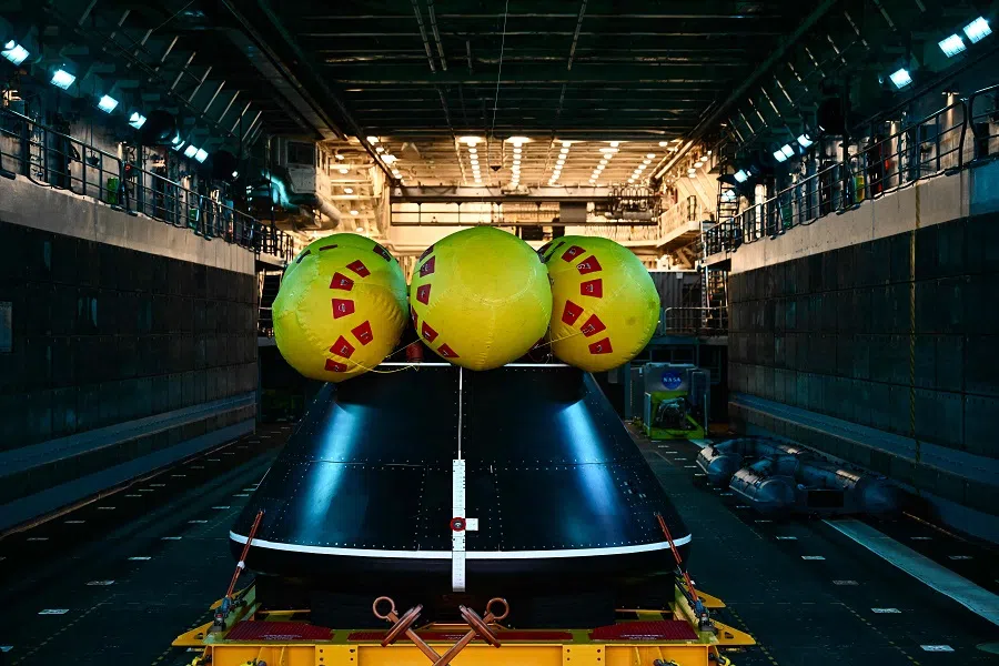 The Orion crew module test capsule rests in the well deck aboard the USS San Diego (LPD-22) at Naval Base San Diego following the Underway Recovery Test 11 in San Diego, California, on 28 February 2024.  (Patrick T. Fallon/AFP)