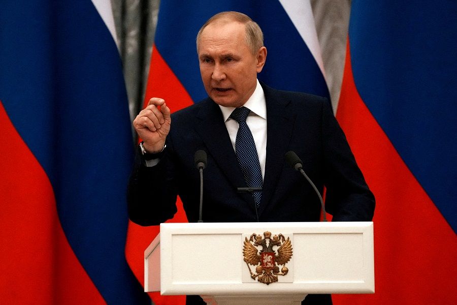 Russian President Vladimir Putin gestures during a press conference with French President Emmanuel Macron, in Moscow, Russia, 7 February 2022. (Thibault Camus/Pool via Reuters)
