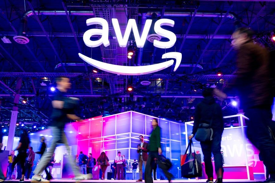 Attendees walk through an expo hall at AWS re:Invent 2023, a conference hosted by Amazon Web Services (AWS), in Las Vegas, Nevada, US, 29 November 2023. (Noah Berger/AWS/Handout via Reuters)
