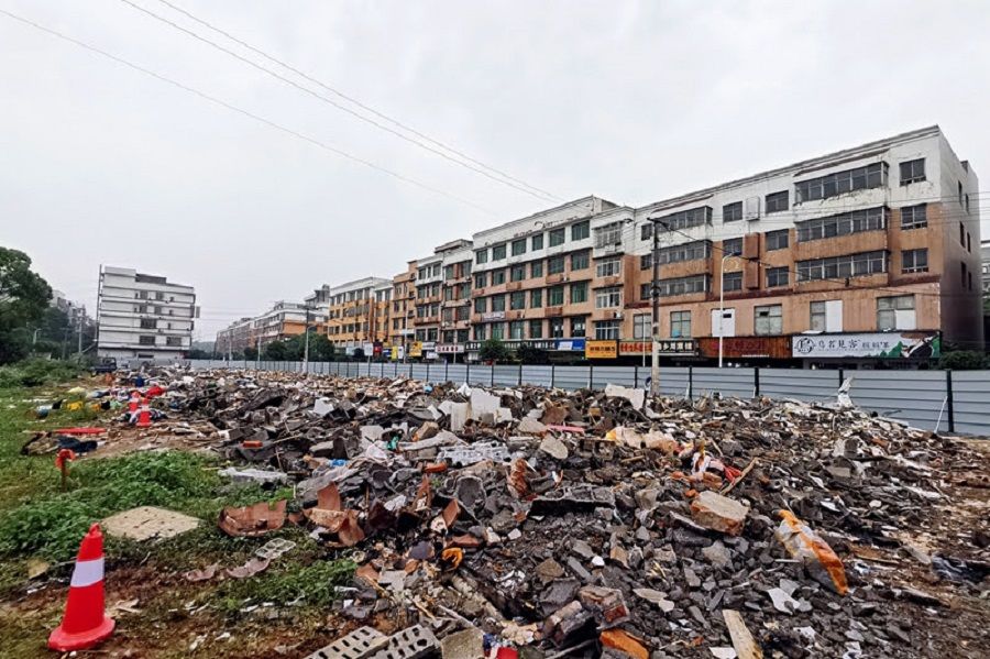 A group of illegal buildings made of tin shacks outside the entrance of Hunan University and Technology and Business were demolished after the 29 April 2022 collapse. (Caixin)