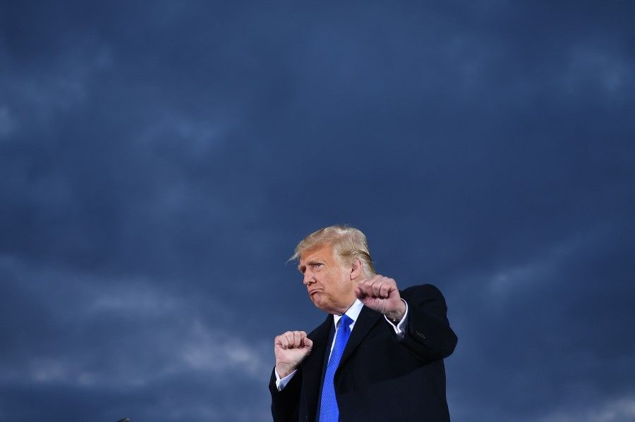 US President Donald Trump gestures during a campaign rally at Pickaway Agriculture and Event Center in Circleville, Ohio on 24 October 2020. (Mandel Ngan/AFP)