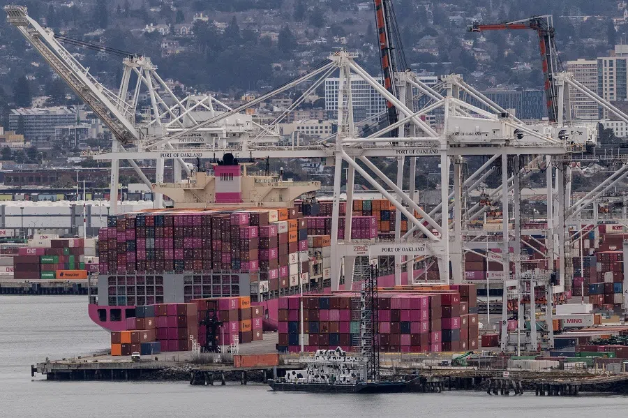 A cargo ship full of shipping containers is seen at the port of Oakland as trade tensions escalate over US tariffs, in Oakland, California, US, on 3 February 2025. (Carlos Barria/Reuters)
