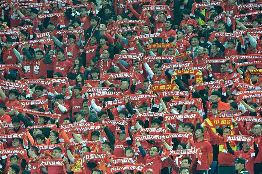 A shot of Chinese football fans at the 2026 FIFA World Cup AFC qualifiers football match between China and Singapore in Tianjin on 26 March 2024. (AFP)