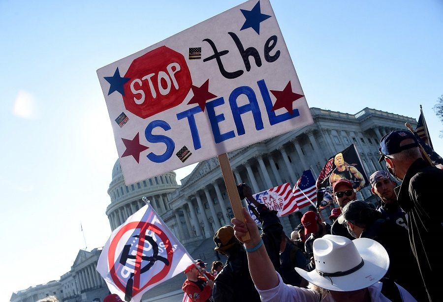 In this file photo taken on 14 November 2020, supporters of US President Donald Trump and his claim that the 3 November election was fraudulent, rally at the US Capitol in Washington, DC, US. (Olivier Douliery/AFP)