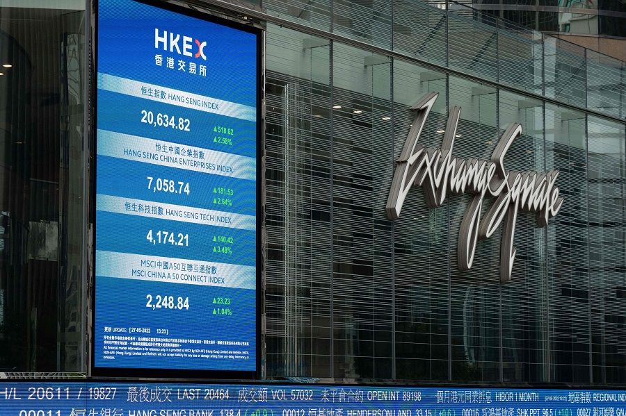 An electronic board displays the Hang Seng Index at Exchange Square in Hong Kong, China, on 27 May 2022. (Bertha Wang/AFP)