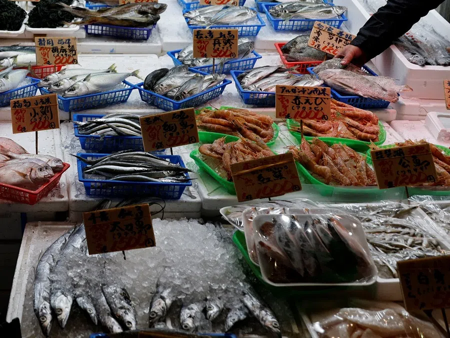 A vendor arranges seafood at a shop in Tokyo, Japan, on 19 November 2025. (Kim Kyung-Hoon/Reuters)