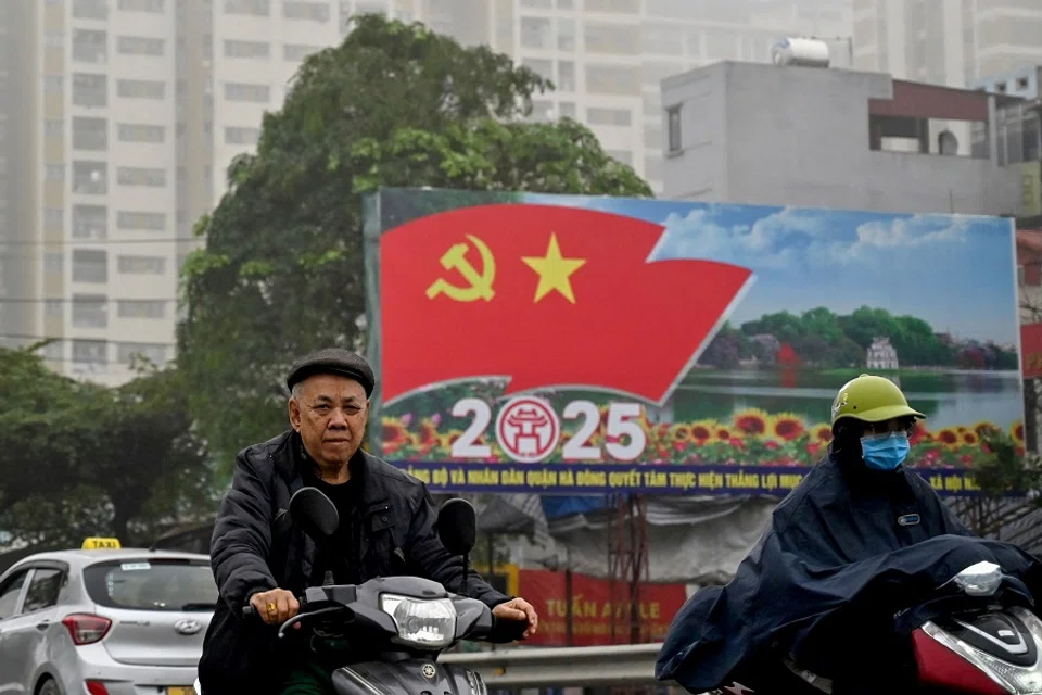 Commuters ride scooters in Hanoi, Vietnam, on 5 March 2025. (Nhac Nguyen/AFP)