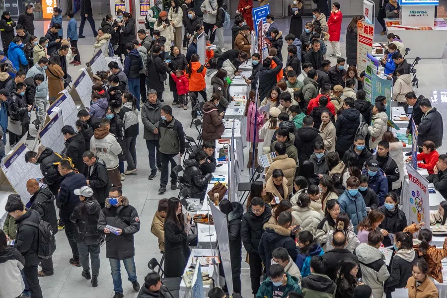 People attend a job fair in Zhengzhou, in central China's Henan province on 19 February 2024. (AFP)