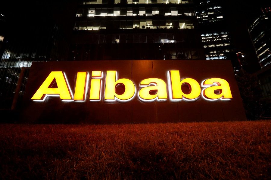 The logo of Alibaba Group is lit up at its office building in Beijing, China, 9 August 2021. (Tingshu Wang/File Photo/Reuters)