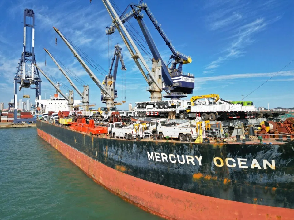 This photo taken on 6 October 2022 shows a cargo ship loaded with vehicles berthing at Yantai Port in China's eastern Shandong province. (AFP)