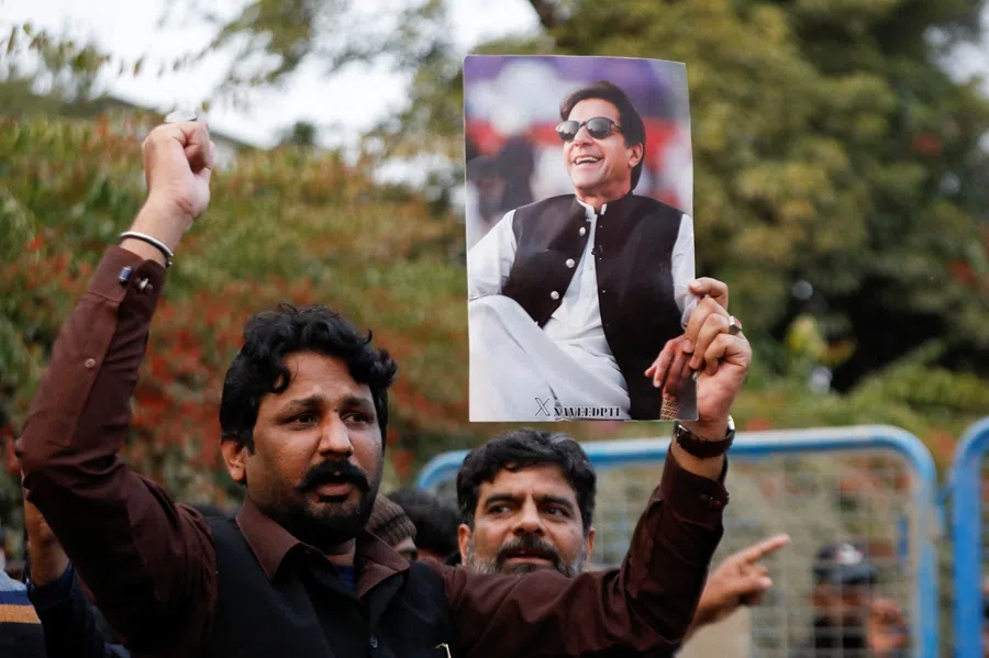 Supporters of jailed former Prime Minister of Pakistan and leader of Pakistan Tehreek-e-Insaf party Imran Khan chant slogans as they gather during a protest over concerns about their leader's health, on a road leading to Adiala jail in Rawalpindi, Pakistan, 9 December 2025. (Salahuddin/Reuters)