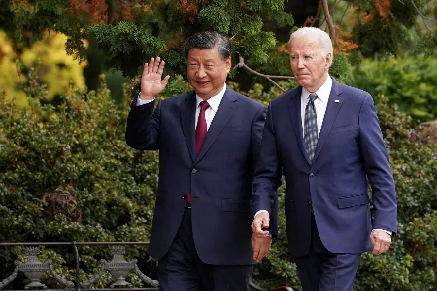 Chinese President Xi Jinping waves as he walks with U.S. President Joe Biden at Filoli estate on the sidelines of the Asia-Pacific Economic Cooperation (APEC) summit, in Woodside, California, US, on 15 November 2023. (Kevin Lamarque/Reuters)