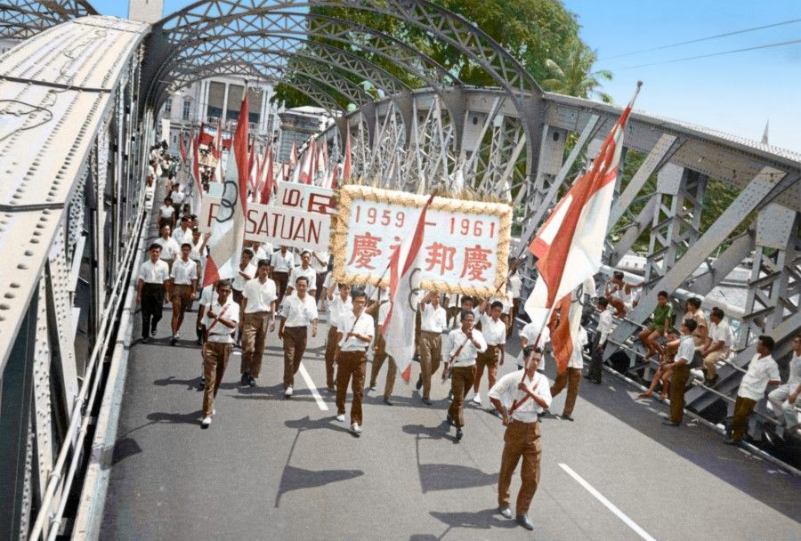 A celebratory parade in Singapore, 1961. The next step was to push for merger with Malaya, with its political objective of a complete break from British colonial rule.