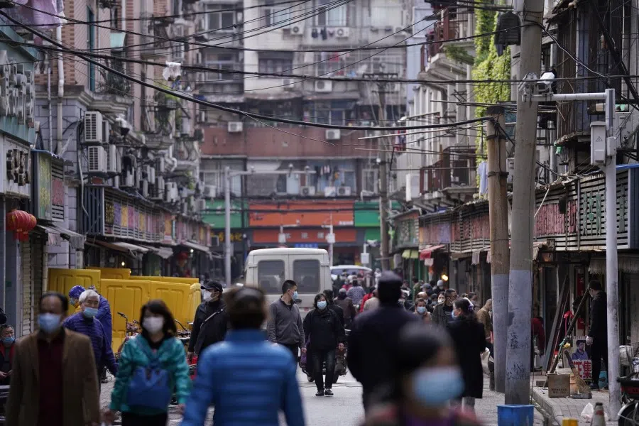 People walk on a street in Wuhan, April 6, 2020. (Aly Song/REUTERS)