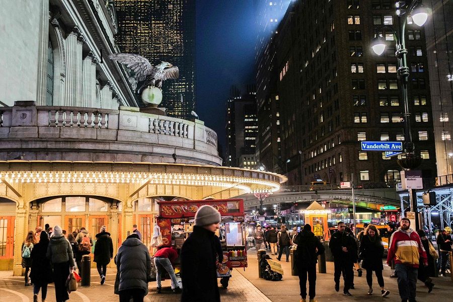 People walk outside the Grand Central Terminal in New York on 26 January 2024. (Charly Triballeau/AFP)